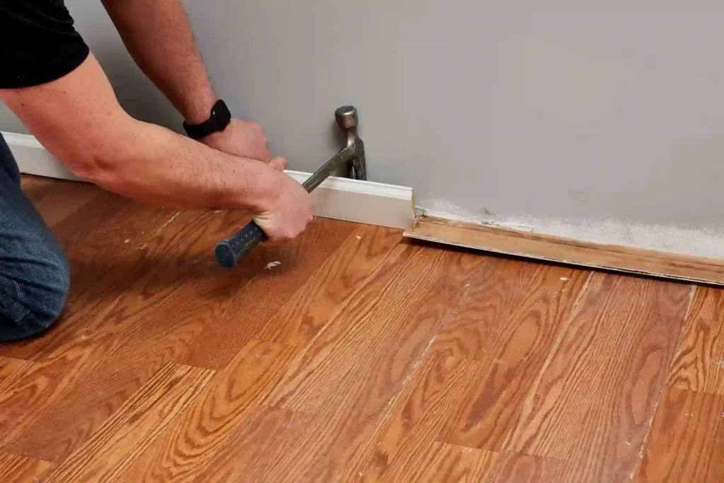 Installing baseboard trim on finished hardwood floor